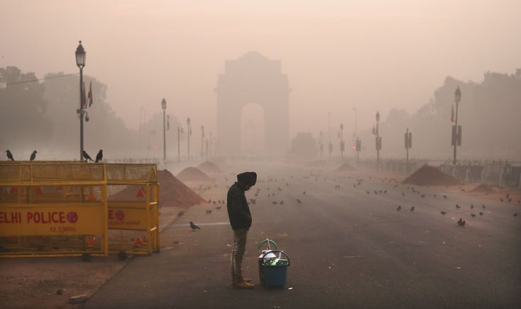 India Firefighters Combat Pollution by Sprinkling Water